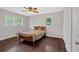 Bedroom features neutral walls, hardwood floors, and a ceiling fan at 1520 Oxford St, Douglasville, GA 30134