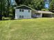 A charming single-story home with a well-manicured front lawn and attached carport at 1520 Oxford St, Douglasville, GA 30134