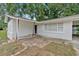 Inviting front porch and entrance with whitewashed brick and covered carport at 1520 Oxford St, Douglasville, GA 30134