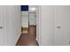 Hallway shows the hardwood floors and neutral paint at 1520 Oxford St, Douglasville, GA 30134