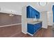 Bright kitchen and dining area features painted cabinets, granite counters and hardwood floors at 1520 Oxford St, Douglasville, GA 30134