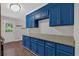 Bright eat-in kitchen features painted cabinetry, granite counters and access to the yard at 1520 Oxford St, Douglasville, GA 30134
