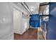 Basement laundry area with painted brick, shelving, and wood look flooring at 1520 Oxford St, Douglasville, GA 30134