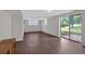 Bright living room featuring wood-look floors and sliding doors leading to the exterior at 1520 Oxford St, Douglasville, GA 30134