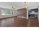 Hardwood floors throughout the living area with natural light and view to kitchen at 1520 Oxford St, Douglasville, GA 30134