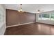 Bright living room features hardwood floors, neutral paint, and a modern ceiling fan at 1520 Oxford St, Douglasville, GA 30134