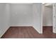 Cozy bonus room featuring neutral colored walls and wood-look flooring at 1520 Oxford St, Douglasville, GA 30134