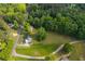 Scenic aerial perspective reveals a beautiful home surrounded by lush greenery and tree coverage at 780 Old Magnolia Trl, Canton, GA 30115
