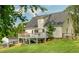 Back of house featuring the deck and large backyard at 780 Old Magnolia Trl, Canton, GA 30115