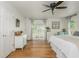 Well-lit bedroom with wood floors, white walls, large windows, and contemporary furnishings at 780 Old Magnolia Trl, Canton, GA 30115