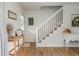 Inviting entryway with a staircase, wood floors, and neutral decor creates a welcoming atmosphere at 780 Old Magnolia Trl, Canton, GA 30115