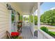 Inviting front porch with charming decor, rocking chair, and lovely landscaping offers a relaxing outdoor space at 780 Old Magnolia Trl, Canton, GA 30115