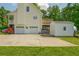 Attached garage with shed, offering plenty of storage space, on a sprawling green lawn at 780 Old Magnolia Trl, Canton, GA 30115