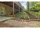 Backyard featuring a patio, stairs, lush greenery, and stone accents, perfect for outdoor enjoyment at 1632 Brookhaven Close Ne, Atlanta, GA 30319