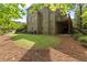 Spacious backyard featuring a well-maintained lawn, brick home exterior, and a wooden deck, perfect for outdoor activities at 1632 Brookhaven Close Ne, Atlanta, GA 30319