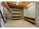 Unfinished basement space with exposed ceiling, concrete walls, shelving, and utilities at 1632 Brookhaven Close Ne, Atlanta, GA 30319