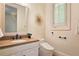 Bathroom showcasing a vanity with a stone countertop and a modern toilet at 1632 Brookhaven Close Ne, Atlanta, GA 30319