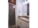 Bathroom featuring a tiled shower and vanity with a large mirror at 1632 Brookhaven Close Ne, Atlanta, GA 30319