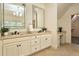 Bright bathroom features double sink vanity and a separate makeup vanity at 1632 Brookhaven Close Ne, Atlanta, GA 30319