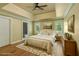Bedroom with a trey ceiling, wooden floors, and shuttered windows for natural light at 1632 Brookhaven Close Ne, Atlanta, GA 30319
