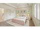 Bright bedroom featuring a plush bed, neutral decor, and bright, shuttered windows at 1632 Brookhaven Close Ne, Atlanta, GA 30319