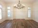 Spacious dining room with hardwood floors, natural light and an elegant light fixture at 1632 Brookhaven Close Ne, Atlanta, GA 30319