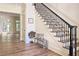 Bright foyer featuring hardwood floors, staircase and view of the light-filled living space at 1632 Brookhaven Close Ne, Atlanta, GA 30319