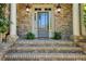 Charming brick home featuring a glass front door with sidelights and brick steps at 1632 Brookhaven Close Ne, Atlanta, GA 30319