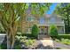 Stunning stone home with a beautiful balcony, manicured landscaping, and a welcoming entrance, radiating curb appeal at 1632 Brookhaven Close Ne, Atlanta, GA 30319