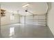 Clean, spacious two-car garage with a painted floor and automatic doors, perfect for parking and storage at 1632 Brookhaven Close Ne, Atlanta, GA 30319