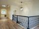 Hallway with hardwood floors and an ornate metal art display on the wall at 1632 Brookhaven Close Ne, Atlanta, GA 30319