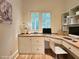 Home office space with custom built in desk, ample storage, and natural light at 1632 Brookhaven Close Ne, Atlanta, GA 30319