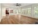 Open living area with hardwood floors, white trim, and large windows at 1632 Brookhaven Close Ne, Atlanta, GA 30319