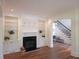 Bright living room with built-in bookshelves and fireplace at 1632 Brookhaven Close Ne, Atlanta, GA 30319
