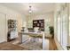 Bright home office with glass desk, shelving, and natural light at 1632 Brookhaven Close Ne, Atlanta, GA 30319