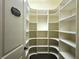 Walk-in pantry with custom shelving providing plenty of storage at 1632 Brookhaven Close Ne, Atlanta, GA 30319