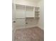 Walk-in closet with shelving and bonus storage space under the main hanging area at 1632 Brookhaven Close Ne, Atlanta, GA 30319