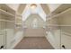 Large walk-in closet with ample shelving and a window to bring in natural light at 1632 Brookhaven Close Ne, Atlanta, GA 30319