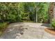 Long concrete driveway in front of a lush green landscape at 1632 Brookhaven Close Ne, Brookhaven, GA 30319