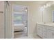 Bright bathroom with double vanity leading to a bedroom with natural light at 354 Hayden Cir, Woodstock, GA 30189