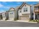 Row of townhomes showing garages, landscaping, and building features in this well-maintained community with street view at 354 Hayden Cir, Woodstock, GA 30189