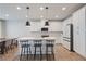 Bright eat-in kitchen featuring a large island with bar seating, modern stainless appliances, and white cabinets at 354 Hayden Cir, Woodstock, GA 30189