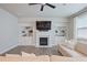 Bright living room featuring a fireplace, built-in shelving, and plush sofa seating with hardwood style flooring at 354 Hayden Cir, Woodstock, GA 30189