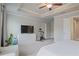 Spacious main bedroom with tray ceiling, seating area, and a view into the ensuite bath and dressing area at 354 Hayden Cir, Woodstock, GA 30189