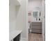 Mudroom with bench seating and storage leads into a half bathroom featuring modern fixtures and wood-look floors at 354 Hayden Cir, Woodstock, GA 30189