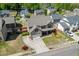 Aerial view of a beautifully landscaped home with a brick facade and well-manicured lawn at 55 Sudderth St, Buford, GA 30518