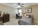Bedroom featuring carpet, a ceiling fan, natural light, and a neutral color scheme at 55 Sudderth St, Buford, GA 30518