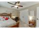 Bright bedroom featuring carpet, a wooden bedframe, a desk, and a window at 55 Sudderth St, Buford, GA 30518