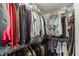Walk-in closet with shelves and hanging rods to organize clothes and accessories at 55 Sudderth St, Buford, GA 30518