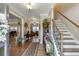 Elegant home foyer with hardwood floors, staircase, and decorative accents at 55 Sudderth St, Buford, GA 30518